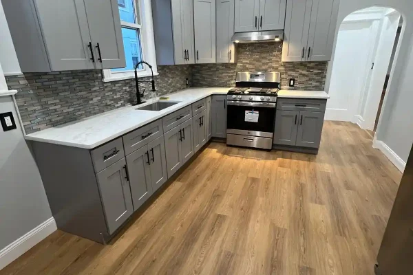 Carpenter installing c counter top in a kitchen